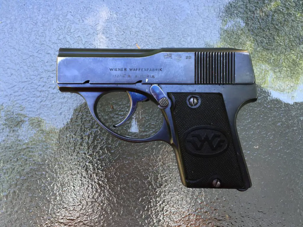 This example was made in Vienna and proofed there in 1922. Note the safety (up is safe, down - here - is fire). No sights; brass mag loads through the top!