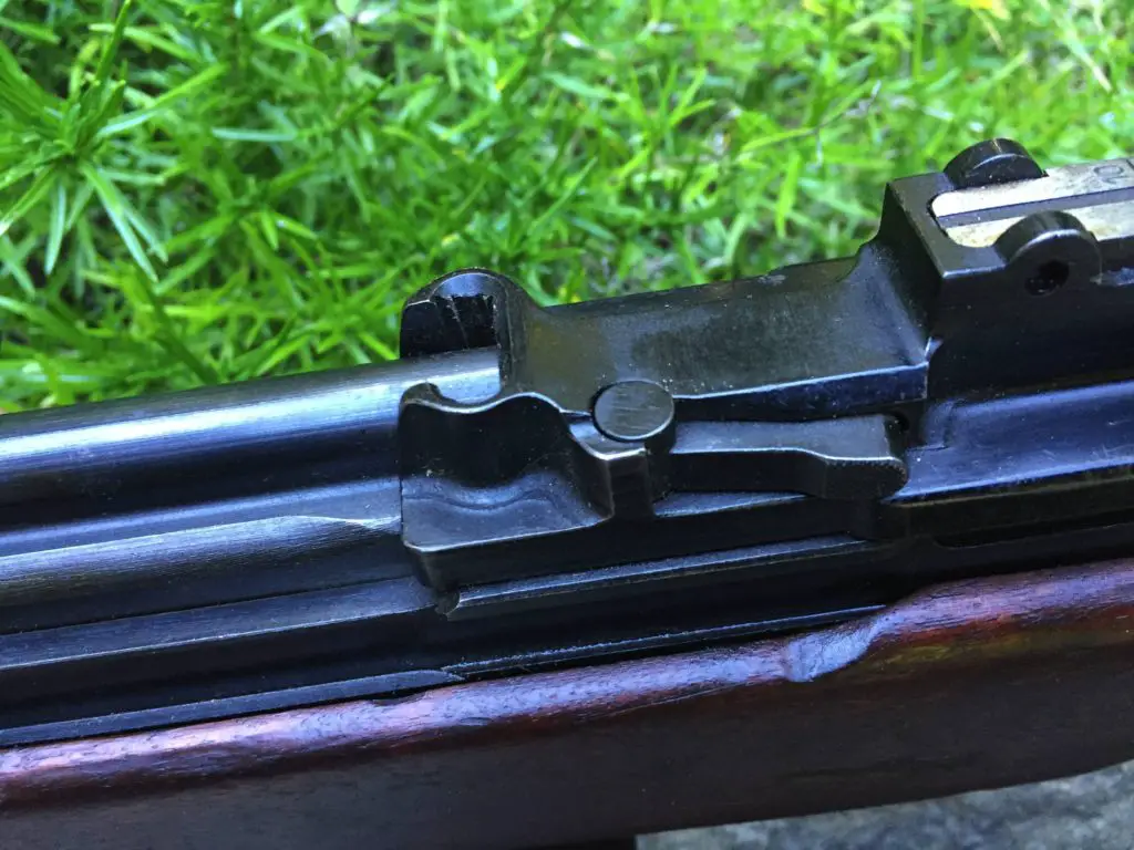 This view from the left shows the bolt hold-open catch on the side of the receiver.