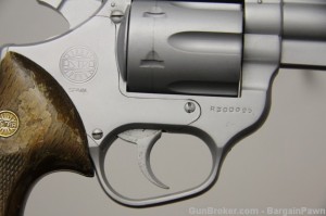Close-up shows finish flaked off grips and trigger with pitting. The gun was in rough shape. 