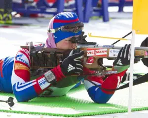A Russian lady biathlete sighting her Izmash in before international competition. Crowley photo.