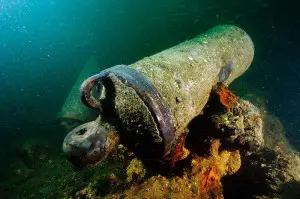 This cannon is part of the scattered wreck of the burnt and sunken flagship L'Oriente.