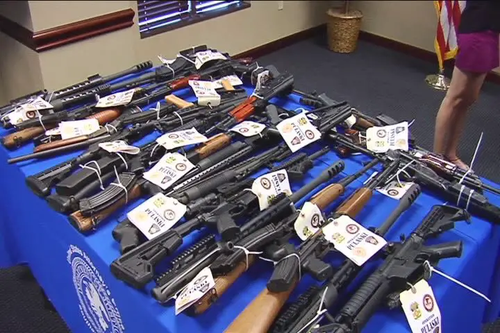 These guns, displayed as seized in a Pulaski, GA storefront sting, are some of the guns ATF keeps in Atlanta for press conferences.