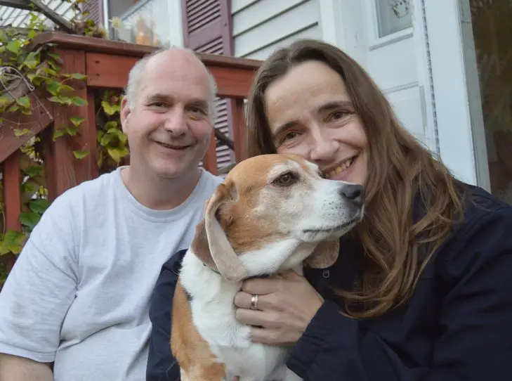 Udo and Nina Barbosa with their volunteer K-9 cop, Lucky.
