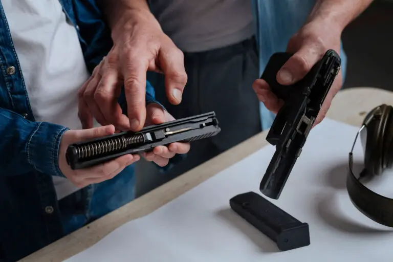 Man explaining the gun parts to a child