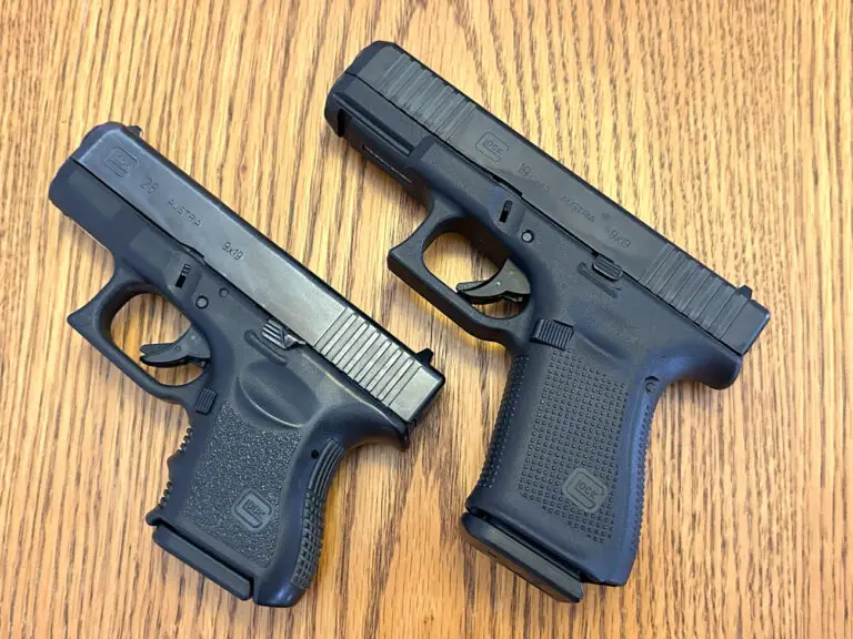 Glock 26 vs 19 Pistols side by side on a table