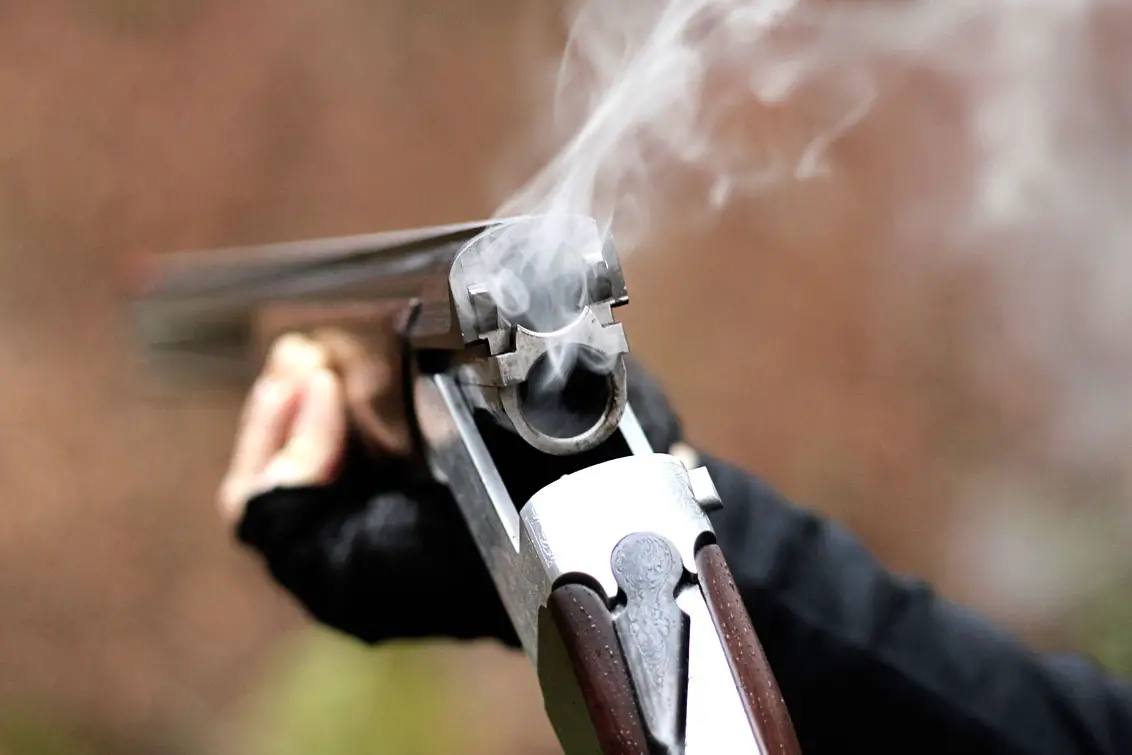 Smoking barrel of a double barreled shotgun after hunting