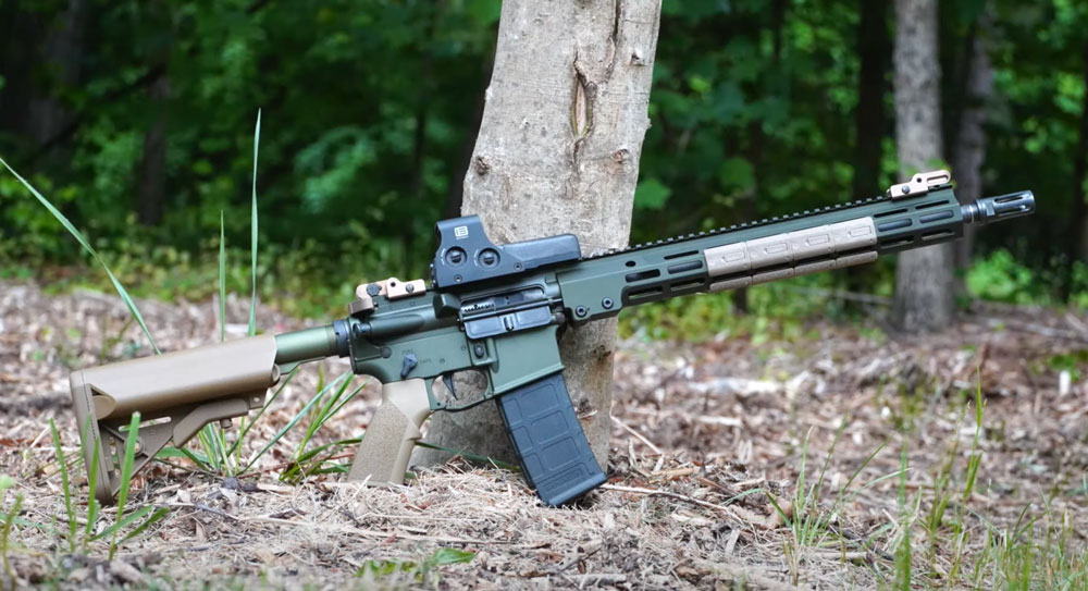 Geissele Super Duty Rifle leaning against a tree