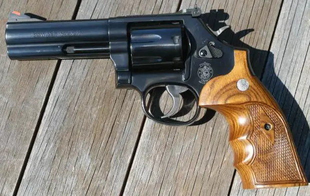 Smith and Wesson 586 Revolver on wood deck