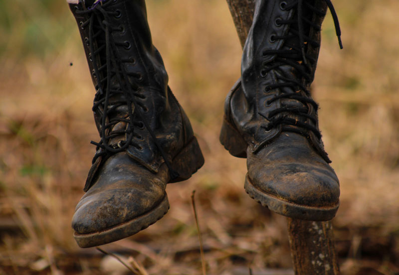 Worn out black boots