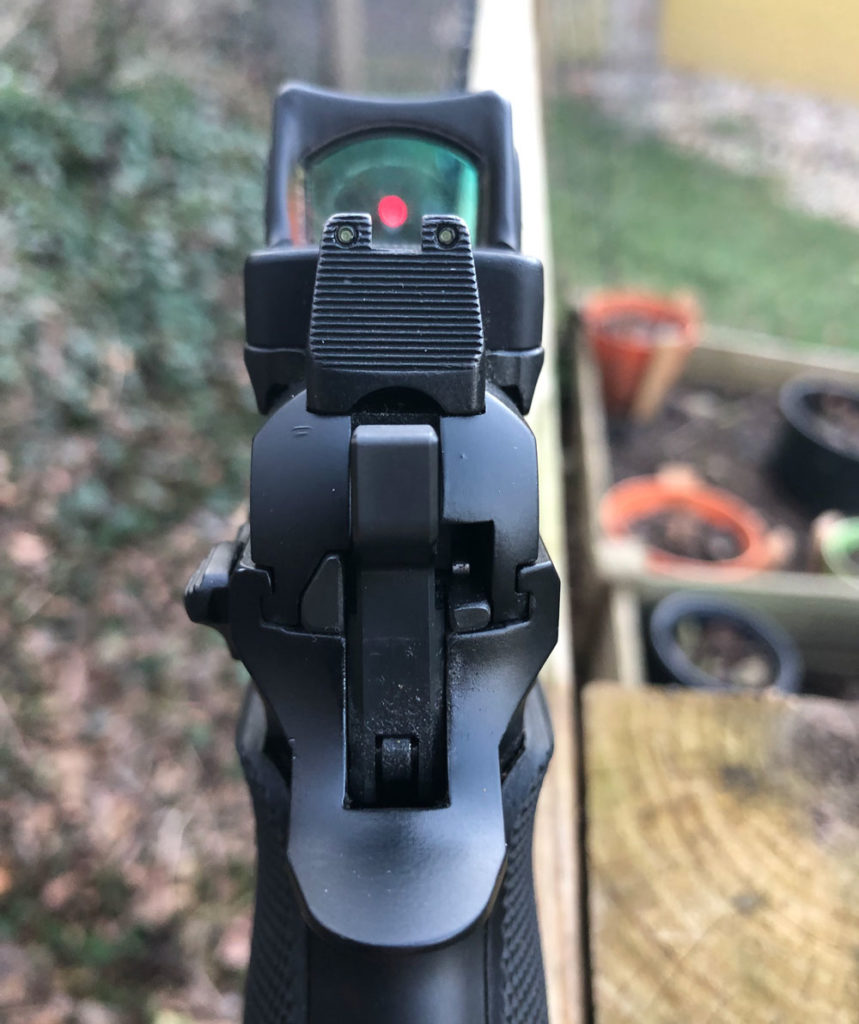 CZ P01 stock iron sights with a trijicon red dot sight added