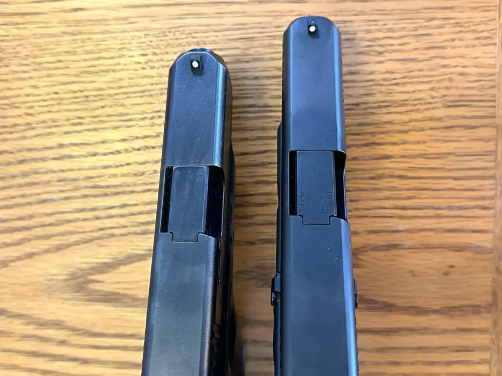 Glock 19 vs Glock 26 top view pistols