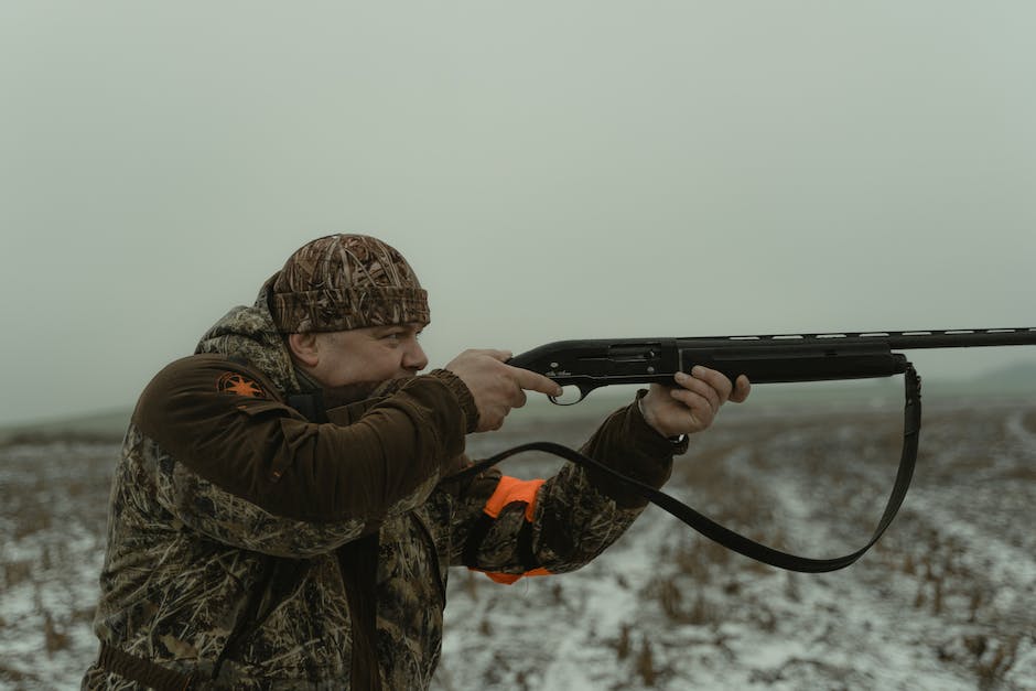 A close-up image of a modern firearm which showcases its advanced technology and sleek design.